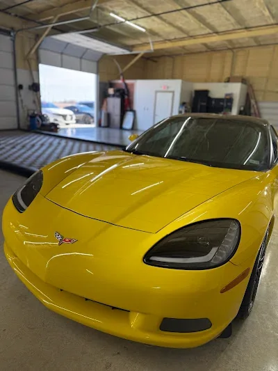 Yellow Chevrolet Corvette with a glossy finish in the Detail Now studio