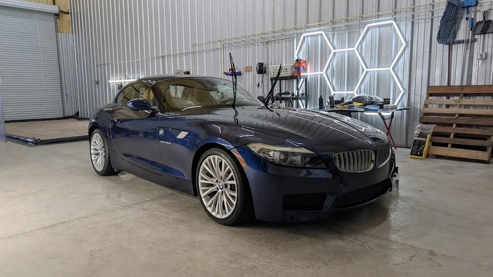 Blue BMW Z4 in the Detail Now studio, photographed by April Hawthorn in her Google review